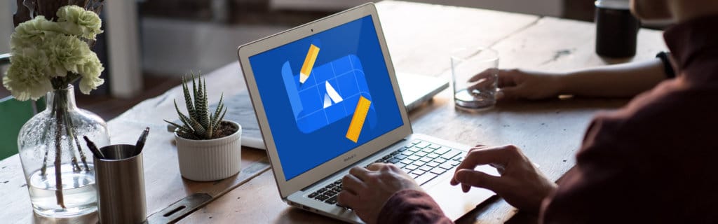 Person typing on computer with Atlassian logo