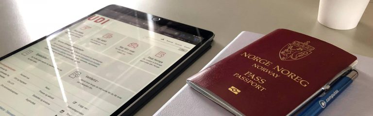 iPad med udi nettside og pass på bord